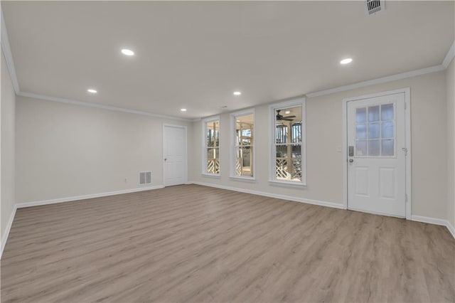 interior space featuring ornamental molding and light wood-type flooring