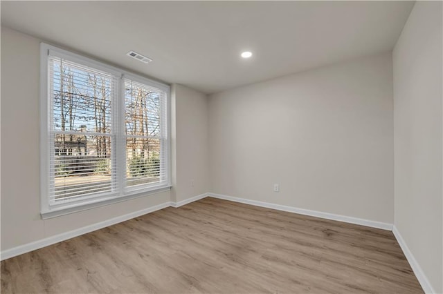 unfurnished room featuring light hardwood / wood-style flooring