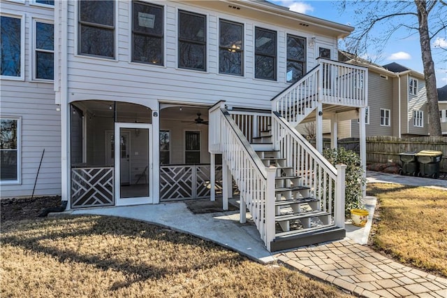 entrance to property featuring ceiling fan