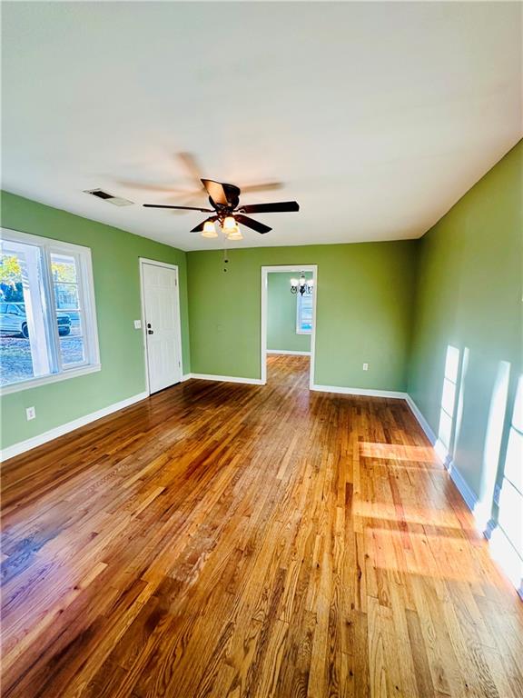 unfurnished room featuring ceiling fan and light hardwood / wood-style floors