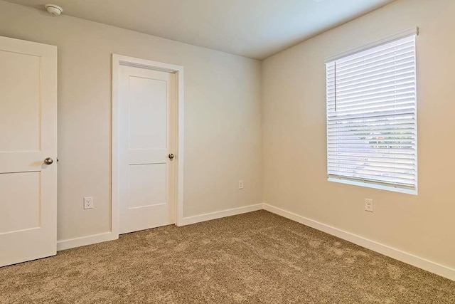 250 Crabapple Rd, Mcdonough, GA 30253 - unfurnished bedroom featuring carpet flooring, multiple windows, and baseboards