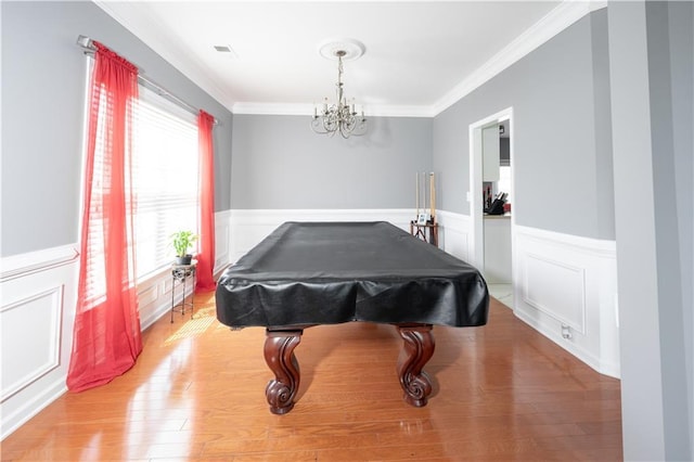 game room with pool table, crown molding, visible vents, and wood finished floors