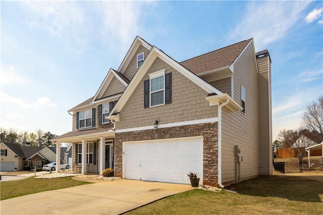 craftsman-style home with concrete driveway, stone siding, a chimney, an attached garage, and a front yard