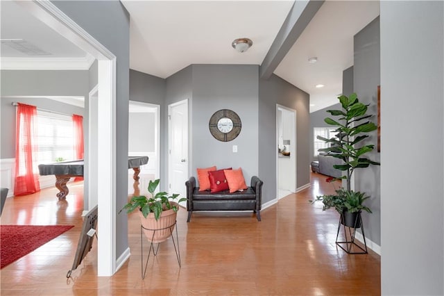 interior space with light wood finished floors, baseboards, and visible vents