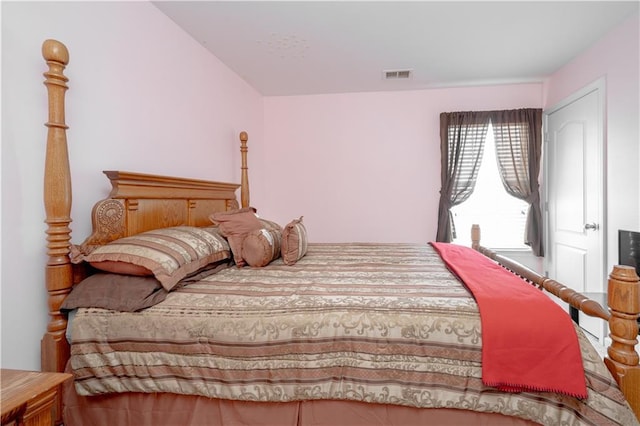 bedroom featuring visible vents