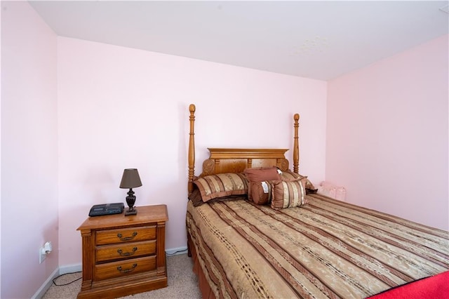 bedroom featuring light carpet