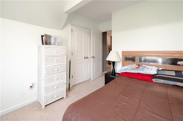 bedroom featuring carpet flooring and baseboards