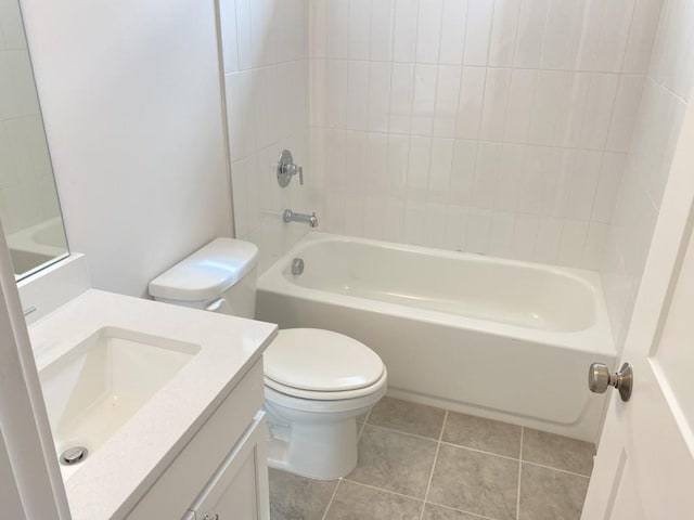 bathroom with tile patterned flooring, tub / shower combination, vanity, and toilet