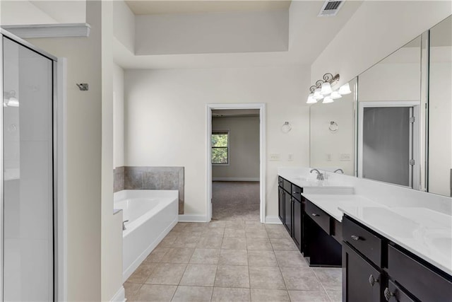 bathroom with visible vents, double vanity, a stall shower, tile patterned floors, and a bath