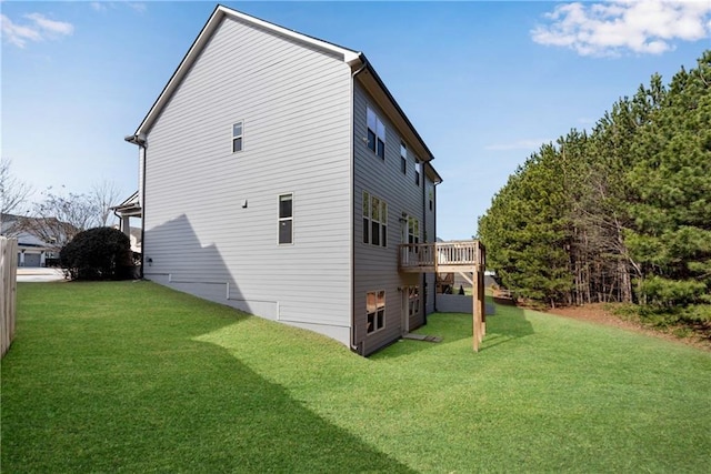 exterior space with a yard and a wooden deck