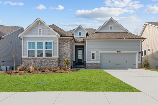 craftsman-style home with a garage and a front yard