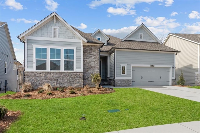 craftsman-style house with a garage and a front lawn