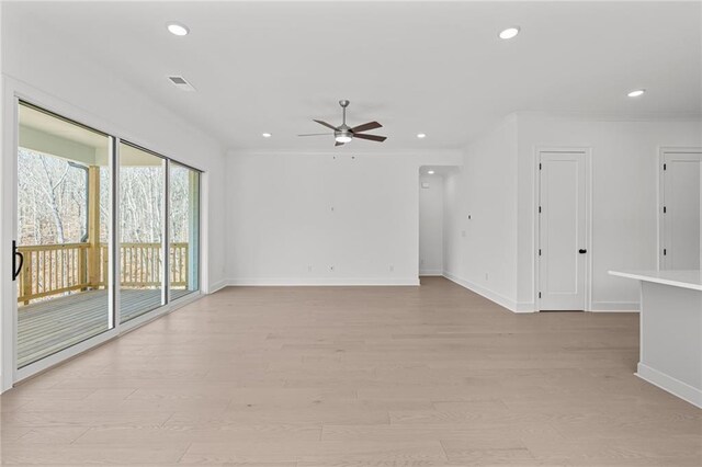 empty room featuring crown molding, light hardwood / wood-style flooring, and ceiling fan