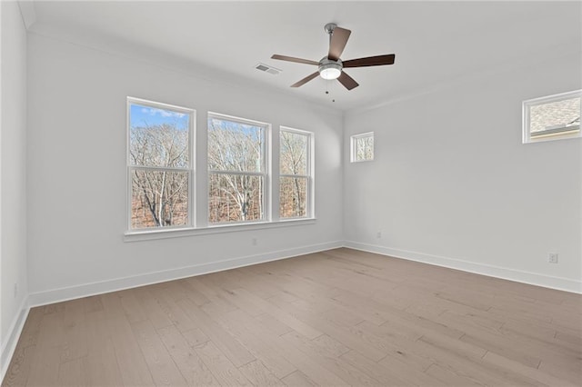 unfurnished room featuring ornamental molding, light hardwood / wood-style floors, and ceiling fan