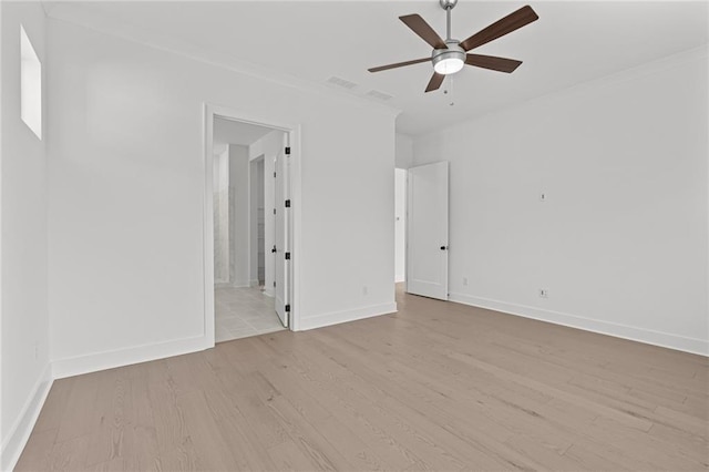 unfurnished room featuring crown molding, light hardwood / wood-style flooring, and ceiling fan