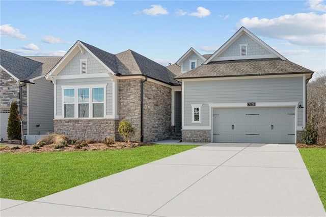 view of front of house with a garage and a front lawn