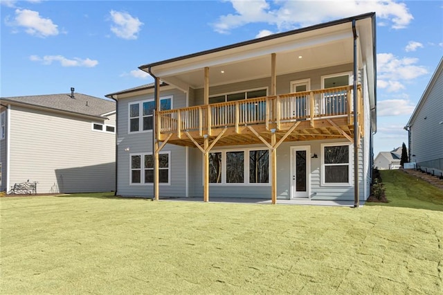 back of property featuring a yard and a patio area