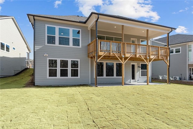 rear view of property with a patio and a yard