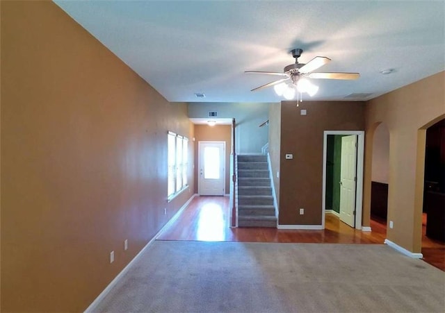 spare room with hardwood / wood-style floors and ceiling fan