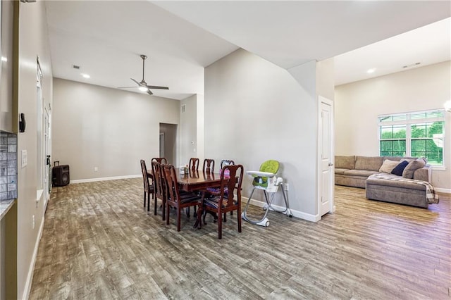 dining area with a ceiling fan, baseboards, wood finished floors, and recessed lighting