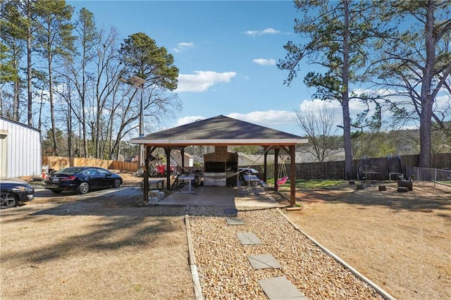 view of yard with a gazebo and fence