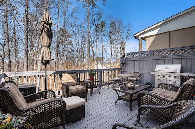 wooden deck with a grill