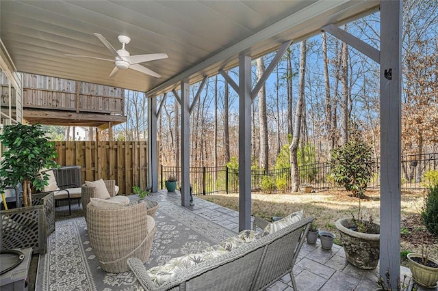 view of patio / terrace featuring an outdoor hangout area, a fenced backyard, and ceiling fan