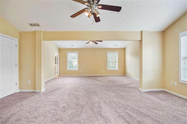 carpeted empty room with ceiling fan