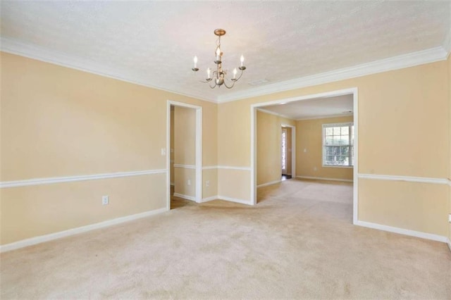 spare room with ornamental molding, light carpet, and a chandelier