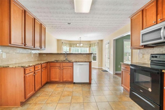 kitchen with sink, kitchen peninsula, black electric range, dishwasher, and decorative backsplash