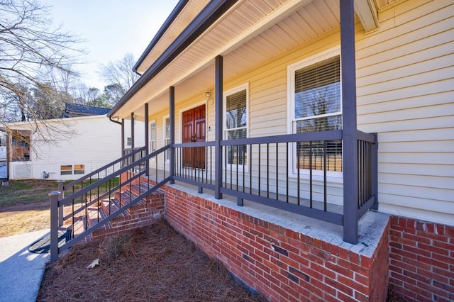 property entrance featuring covered porch