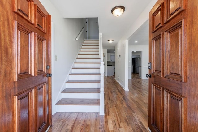 entrance foyer with hardwood / wood-style floors