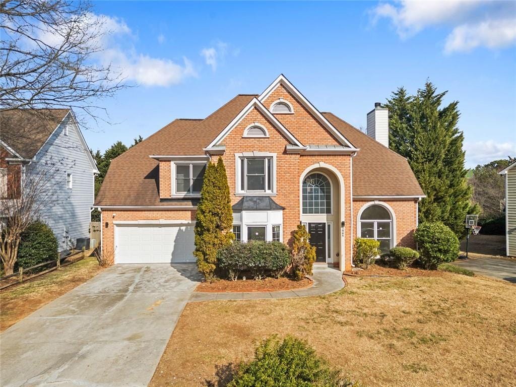 view of front property with a garage and a front yard