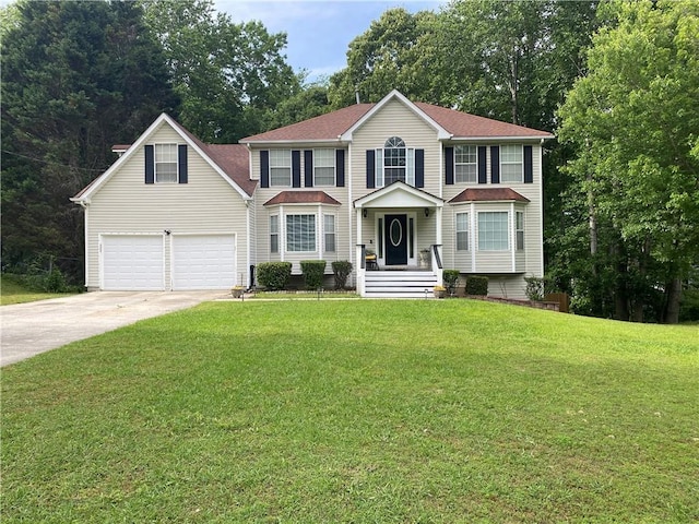 view of front of house with driveway and a front yard