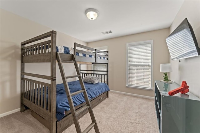 bedroom featuring visible vents, carpet floors, and baseboards