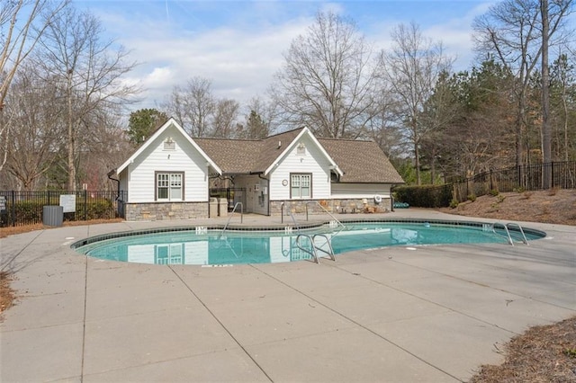 pool featuring a patio area and fence