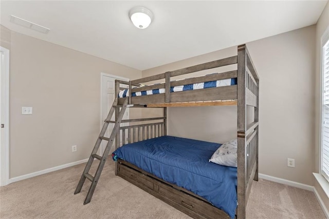 bedroom featuring visible vents, carpet, and baseboards