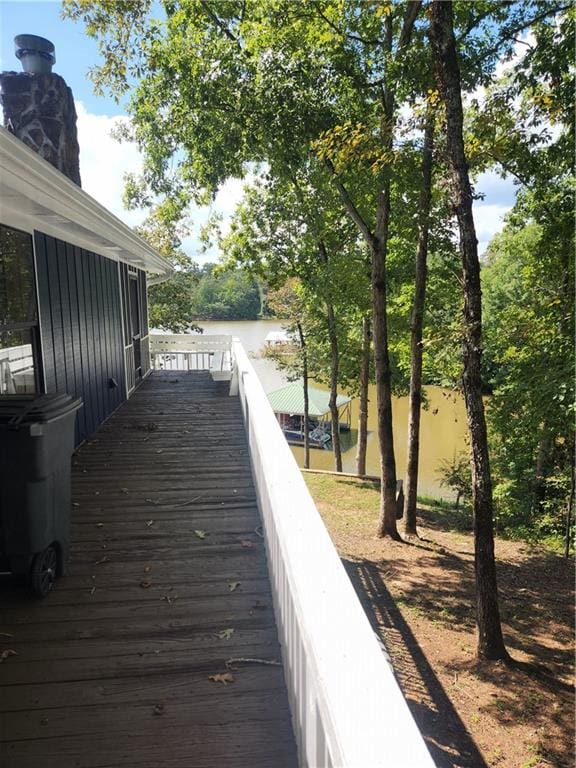 wooden deck featuring a water view