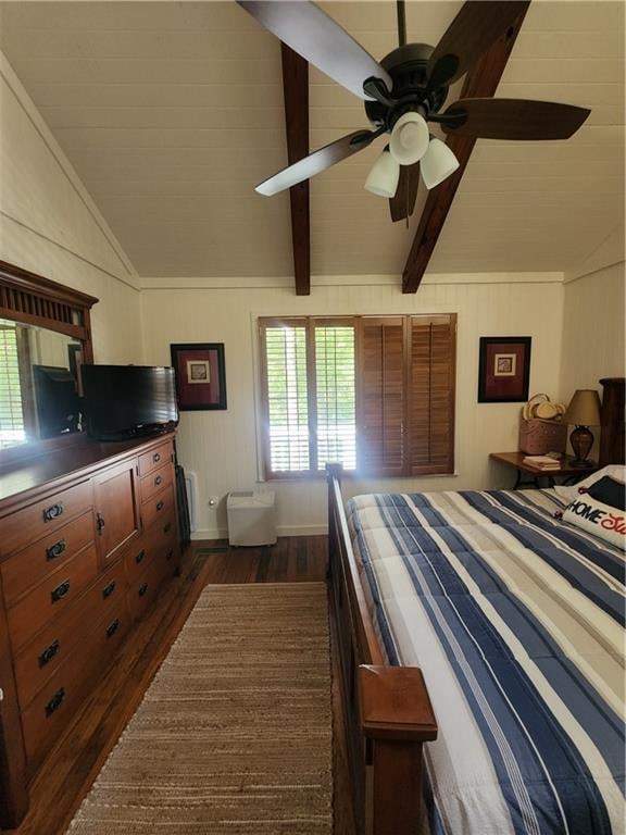 bedroom featuring lofted ceiling with beams, dark hardwood / wood-style flooring, and ceiling fan