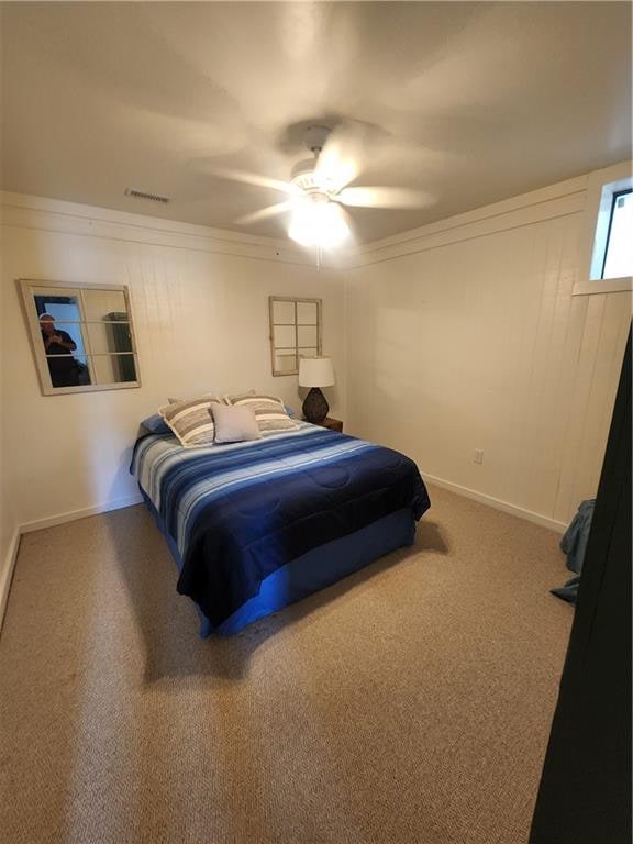 bedroom with ceiling fan and carpet floors