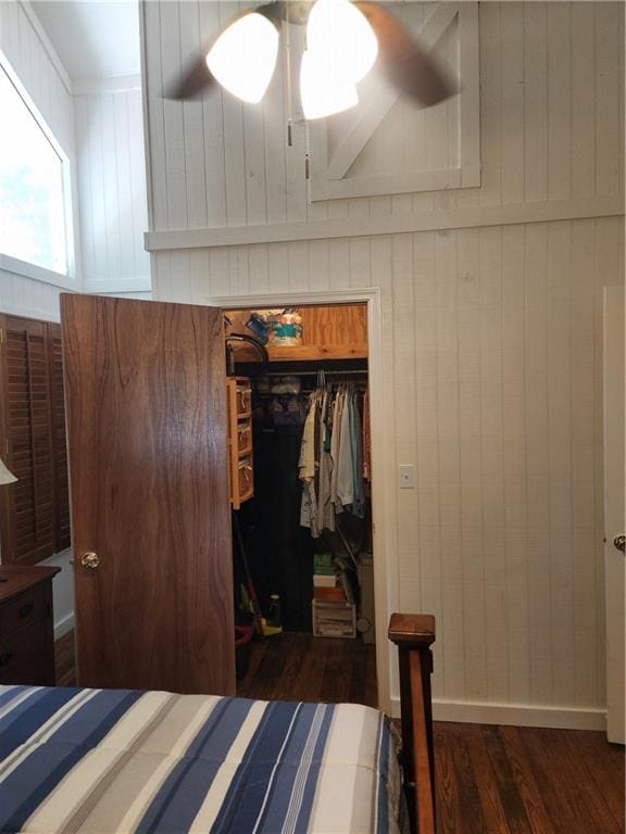 bedroom featuring a closet, ceiling fan, and dark wood-type flooring