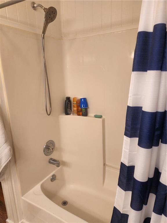 bathroom featuring shower / tub combo with curtain