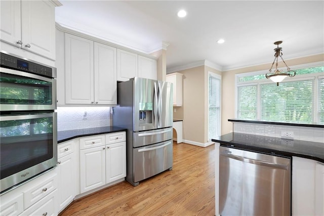 4957 Day Lily Way NW, Acworth, GA 30102 - kitchen featuring appliances with stainless steel finishes, crown molding, decorative backsplash, white cabinets, and light wood-style floors