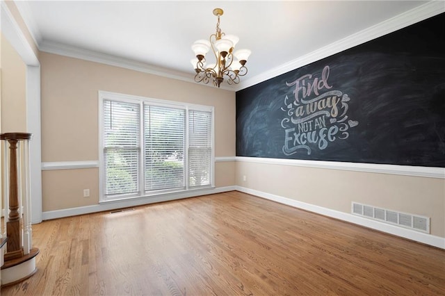 4957 Day Lily Way NW, Acworth, GA 30102 - spare room featuring a chandelier, baseboards, wood finished floors, and ornamental molding