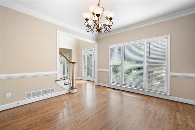4957 Day Lily Way NW, Acworth, GA 30102 - empty room with baseboards, stairway, wood finished floors, a chandelier, and crown molding