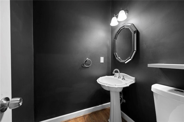 4957 Day Lily Way NW, Acworth, GA 30102 - bathroom with baseboards, wood finished floors, and toilet