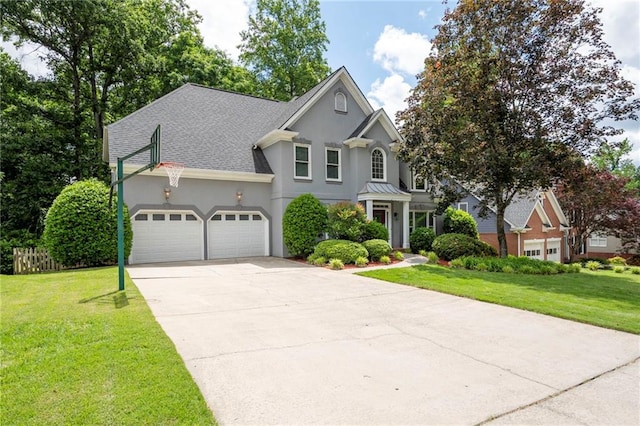 4957 Day Lily Way NW, Acworth, GA 30102 - traditional-style home featuring stucco siding, concrete driveway, an attached garage, a front yard, and roof with shingles