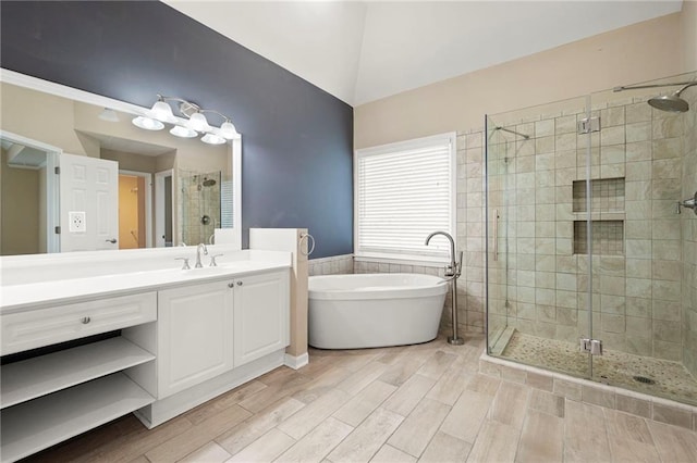 4957 Day Lily Way NW, Acworth, GA 30102 - full bath with a stall shower, a soaking tub, vanity, wood finished floors, and a wainscoted wall