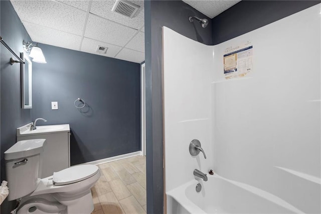 4957 Day Lily Way NW, Acworth, GA 30102 - bathroom with toilet,  shower combination, a paneled ceiling, vanity, and wood finished floors