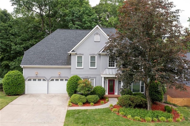4957 Day Lily Way NW, Acworth, GA 30102 - view of front of home with stucco siding, a shingled roof, driveway, an attached garage, and fence